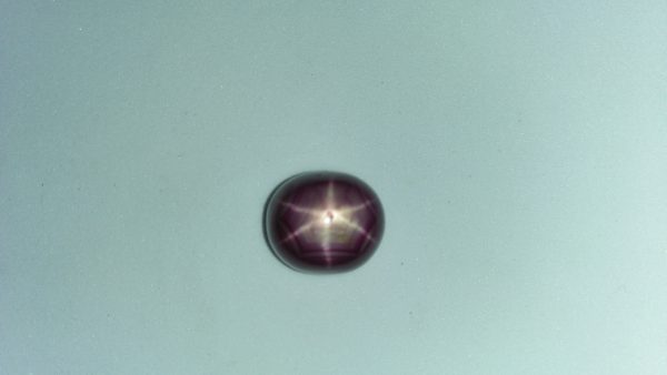 Ceylon Natural Star Ruby A star sapphire is a type of sapphire that exhibits a star-like phenomenon known as asterism. Star sapphires contain intersecting needle-like inclusions following the underlyingcrystal structure that causes the appearance of a six-rayed "star"-shaped pattern when viewed with a single overhead light source. Healing Properties Sapphire helps the user stay on the Spiritual Path, boosting psychic and spiritual powers, and is a great stone for Earth and Chakra healing. also, all corundums share some energies in common, the various colours of Sapphire have individual vibrational signatures and different spiritual properties. Sapphire was used by the Etruscans over 2,500 years ago and was also prized in ancient Rome, Greece and Egypt. Revered as a stone of royalty, sapphire was believed to keep kings safe from harm or envy.