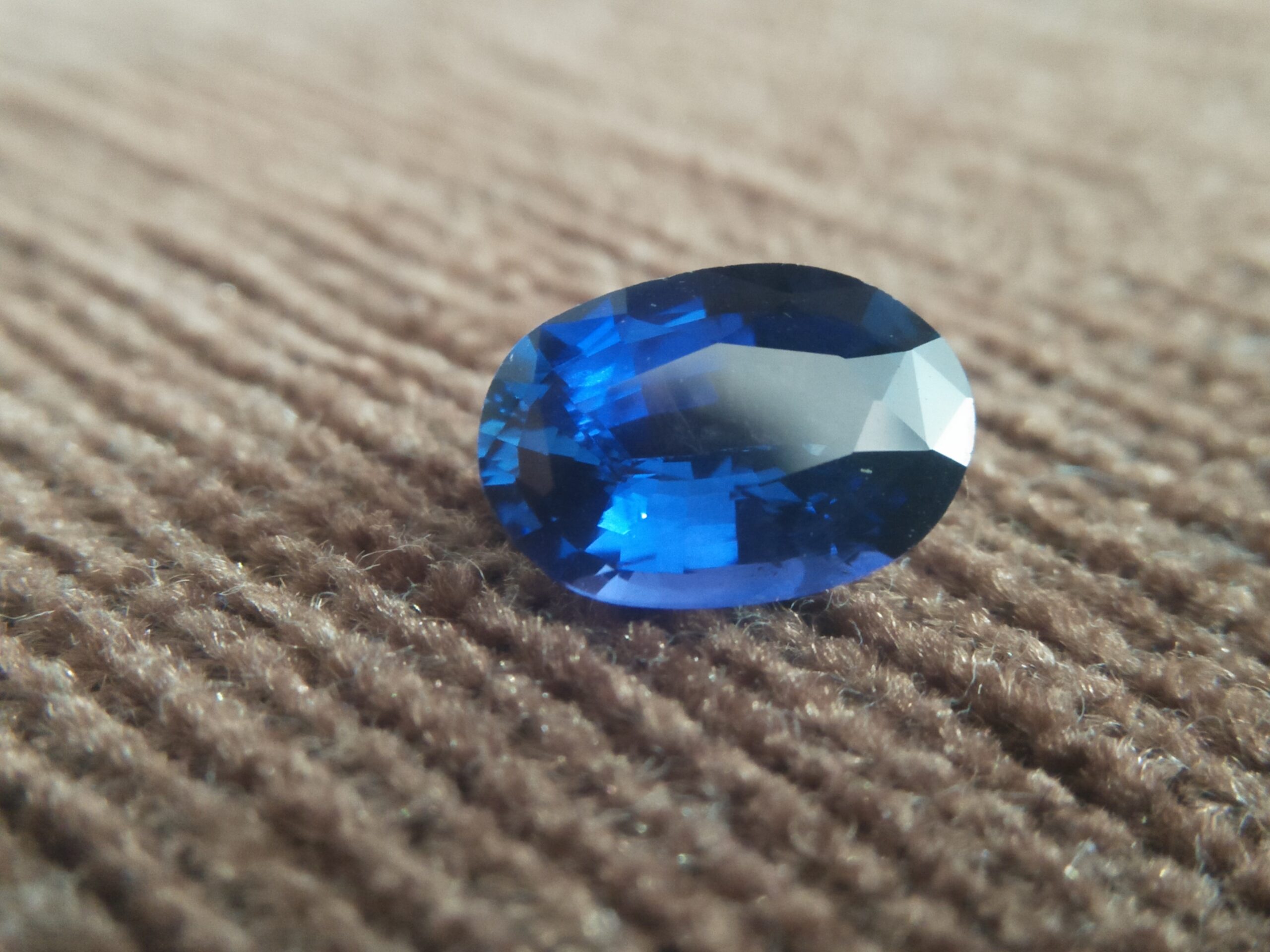 NATURAL BLUE SAPPHIRE Colour : Peacock Blue Shape : Oval Weight : 3.09 CTS Dimension : 10.4 x 7.2 x 4.8 mm Treatment : Heated Clarity : SI • CSL - Colored Stone Laboratory Certified ( GIA Alumina Association Member ) • CSL Memo No : 2F67B4C234D2 Sapphire is a precious gemstone, a variety of the mineral corundum, consisting of aluminum oxide with trace amounts of elements such as iron, titanium, chromium, copper, or magnesium. Sapphire deposits are found in Eastern Australia, Thailand, Sri Lanka, China, Vietnam, Madagascar, Greenland, East Africa, and in North America in mostly in Montana. Madagascar, Sri Lanka, and Kashmir produce large quantities of fine quality Sapphires for the world market. Sapphires are mined from alluvial deposits or from primary underground workings. Blue Sapphire and Ruby are the most popular Gemstone in Corundum Family. also, Orangy Pink Sapphire is called Padparadscha. The name Drive's from the Sinhalese word "padmaraga" " පද්මරාග", meaning lotus blossom, as the stone is of a similar color to the lotus blossom. Bi-Color Sapphire from DanuGroup Collection Also, Sapphire can be found as parti-color, bi-color or fancy color. Australia is a main parti-color Sapphire producer. White Sapphire also, White sapphire is a very popular stone to wear instead of Diamond as a 3rd hardness gemstone after diamond ( moissanite hardness is 9.5). Various colors of star sapphires A star sapphire is a type of sapphire that exhibits a star-like phenomenon known as asterism. Also, A rare variety of natural sapphire, known as color-change sapphire, exhibits different colors in a different light. Sapphires can be treated by several methods to enhance and improve their clarity and color. A common method is done by heating the sapphires in furnaces to temperatures between 500 and 1,850 °C for several hours, or by heating in a nitrogen-deficient atmosphere oven for 1 week or more. Geuda is a form of the mineral corundum. Geuda is found primarily in Sri Lanka. It's a semitransparent and milky appearance due to rutile inclusions. Geuda is used to improve its color by heat treatment. Some geuda varieties turn to a blue color after heat treatments and some turn to red after oxidizing. Also, Kowangu pushparaga turns to yellow sapphire after oxidizing. Sapphire Crystal system is a Trigonal crystal system with a hexagonal scalenohedral crystal class. Sapphire hardness is 9 according to the Mohs hardness scale with 4.0~4.1 specific gravity. Refractive index ω =1.768–1.772 nε =1.760–1.763 Solubility = Insoluble Melting point = 2,030–2,050 °C Birefringence = 0.008 Pleochroism = Strong Luster = Vitreous Sapphire is the birthstone for September and the gem of the 45th anniversary. Healing Properties of Sapphire Sapphire releases mental tension, depression, unwanted thoughts, and spiritual confusion. Sapphire is known as a "stone of Wisdom". It is exceptional for calming and focusing the mind, allowing the release of mental tension and unwanted thoughts. Sapphire is also the best stone for awakening chakras. Dark Blue or Indigo Sapphire stimulates the Third Eye chakra. Blue Sapphire stimulates the Throat Chakra. Green sapphire stimulates Heart Chakra. Black Sapphire stimulates Base Chakra. White sapphire stimulates Crown Chakra. Yellow sapphire stimulates Solar Plexus Chakra. Blue Sapphire stimulates the Throat Chakra and Third eye chakra, the voice of the body. Blue crystal energy will unblock and balance the Throat Chakra. blue encourages the power of truth, while lighter shades carry the power of flexibility, relaxation, and balance. Blue Sapphire can free one of mental anxiety, helps make one detached, and protects against envy. Also, It can be worn for good luck and for protection against evil spirits. Since Saturn rules the nervous system, blue sapphires help problems of the nerves-tension and neuroses-diseases caused by an afflicted Saturn.