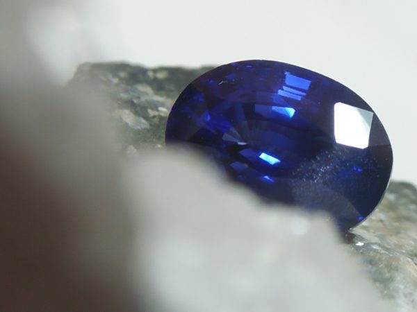 NATURAL BLUE SAPPHIRE Colour : Vivid Blue "Royal Blue" Shape : Oval Weight : 2.16 CTS Dimension : 8.4 x 6.1 x 4.9 mm Treatments : Heated Clarity : SI • CSL - Colored Stone Laboratory Certified ( GIA Alumina Association Member ) • CSL Memo No : E63051265A61 Sapphire is a precious gemstone, a variety of the mineral corundum, consisting of aluminum oxide with trace amounts of elements such as iron, titanium, chromium, copper, or magnesium. Sapphire deposits are found in Eastern Australia, Thailand, Sri Lanka, China, Vietnam, Madagascar, Greenland, East Africa, and in North America in mostly in Montana. Madagascar, Sri Lanka, and Kashmir produce large quantities of fine quality Sapphires for the world market. Sapphires are mined from alluvial deposits or from primary underground workings. Blue Sapphire and Ruby are the most popular Gemstone in Corundum Family. also, Orangy Pink Sapphire is called Padparadscha. The name Drive's from the Sinhalese word "padmaraga" " පද්මරාග", meaning lotus blossom, as the stone is of a similar color to the lotus blossom. Bi-Color Sapphire from DanuGroup Collection Also, Sapphire can be found as parti-color, bi-color or fancy color. Australia is a main parti-color Sapphire producer. White Sapphire also, White sapphire is a very popular stone to wear instead of Diamond as a 3rd hardness gemstone after diamond ( moissanite hardness is 9.5). Various colors of star sapphires A star sapphire is a type of sapphire that exhibits a star-like phenomenon known as asterism. Also, A rare variety of natural sapphire, known as color-change sapphire, exhibits different colors in a different light. Sapphires can be treated by several methods to enhance and improve their clarity and color. A common method is done by heating the sapphires in furnaces to temperatures between 500 and 1,850 °C for several hours, or by heating in a nitrogen-deficient atmosphere oven for 1 week or more. Geuda is a form of the mineral corundum. Geuda is found primarily in Sri Lanka. It's a semitransparent and milky appearance due to rutile inclusions. Geuda is used to improve its color by heat treatment. Some geuda varieties turn to a blue color after heat treatments and some turn to red after oxidizing. Also, Kowangu pushparaga turns to yellow sapphire after oxidizing. Sapphire Crystal system is a Trigonal crystal system with a hexagonal scalenohedral crystal class. Sapphire hardness is 9 according to the Mohs hardness scale with 4.0~4.1 specific gravity. Refractive index ω          =1.768–1.772 nε =1.760–1.763 Solubility = Insoluble Melting point = 2,030–2,050 °C Birefringence  = 0.008 Pleochroism = Strong Luster = Vitreous Sapphire is the birthstone for September and the gem of the 45th anniversary. Healing Properties of Sapphire Sapphire releases mental tension, depression, unwanted thoughts, and spiritual confusion.  Sapphire is known as a "stone of Wisdom". It is exceptional for calming and focusing the mind, allowing the release of mental tension and unwanted thoughts. Sapphire is also the best stone for awakening chakras. Dark Blue or Indigo Sapphire stimulates the Third Eye chakra. Blue Sapphire stimulates the Throat Chakra. Green sapphire stimulates Heart Chakra. Black Sapphire stimulates Base Chakra. White sapphire stimulates Crown Chakra. Yellow sapphire stimulates Solar Plexus Chakra. Blue Sapphire stimulates the Throat Chakra and Third eye chakra, the voice of the body. Blue crystal energy will unblock and balance the Throat Chakra. blue encourages the power of truth, while lighter shades carry the power of flexibility, relaxation, and balance. Blue Sapphire can free one of mental anxiety, helps make one detached, and protects against envy. Also, It can be worn for good luck and for protection against evil spirits. Since Saturn rules the nervous system, blue sapphires help problems of the nerves-tension and neuroses-diseases caused by an afflicted Saturn.