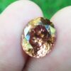 Ceylon Natural Jacinth Zircon Colour : Orangy Brown Shape : Oval Weight : 8.48 CTS Dimension : 12.1 x 10.2 x 7.2 mm Treatment : None/Unheated Clarity : Clean • CSL - Colored Stone Laboratory Certified ( GIA Alumina Association Member ) • CSL Memo No : ABD49DE09EA9