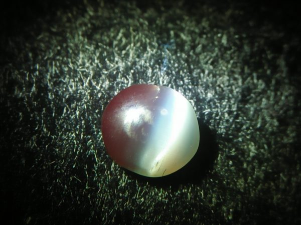 Natural Alexandrite Cats Eye Colour : c.c from Deep Green to deep red Shape : Round Cut : Cabochon Weight : 0.44 Cts Dimension : 4.8 x 4.3 x 2.2 mm Treatment : Unheated
