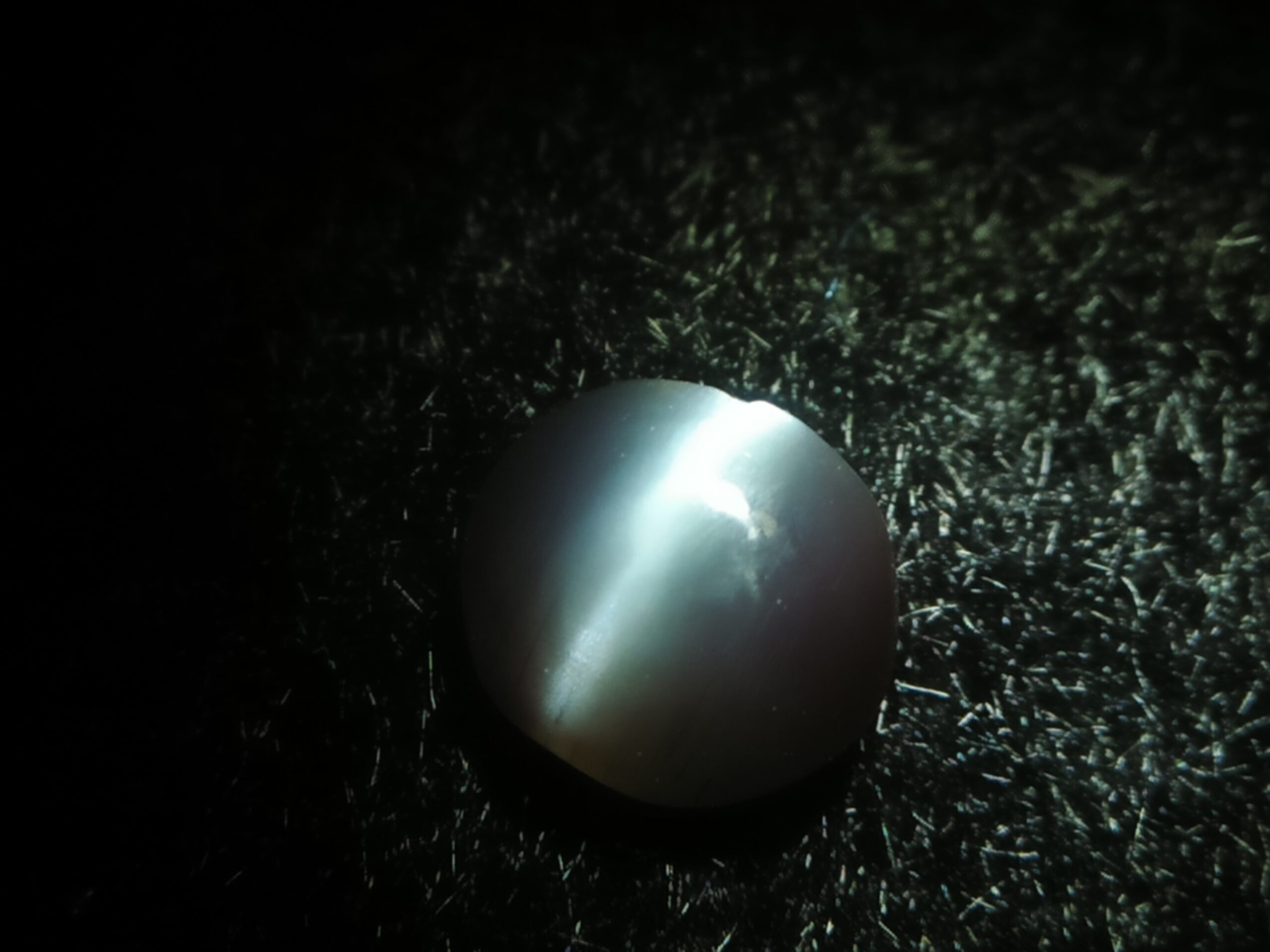 Natural Alexandrite Cats Eye Colour : c.c from Deep Green to deep red Shape : Round Cut : Cabochon Weight : 0.44 Cts Dimension : 4.8 x 4.3 x 2.2 mm Treatment : Unheated