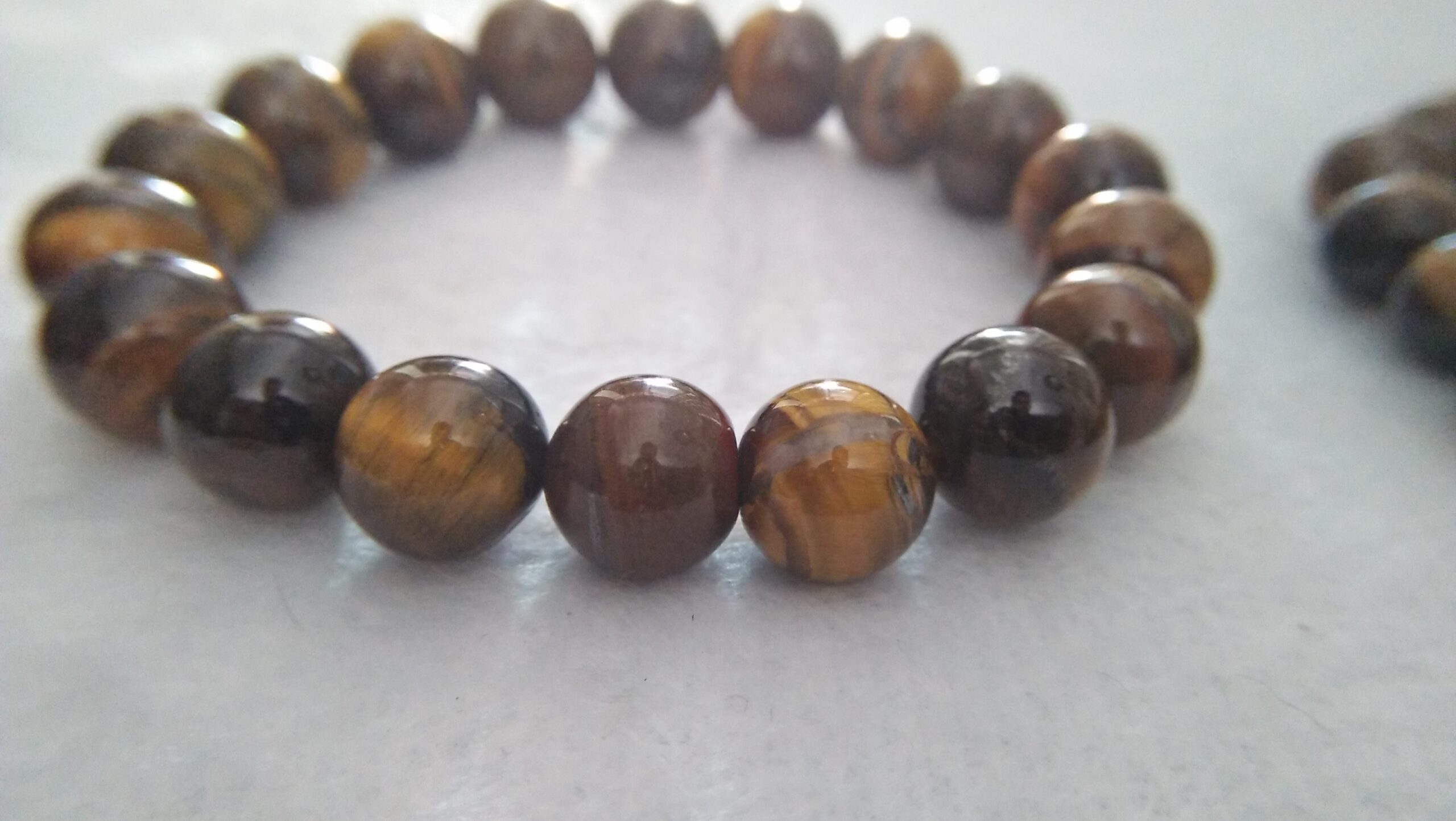 Tiger Eye Bracelet  Stone : Natural Tiger Eye Shape : Round Size : 8.8mm / 10.3mm / 12mm Treatment : Unheated / Natural Design : Gent / Ladies Both