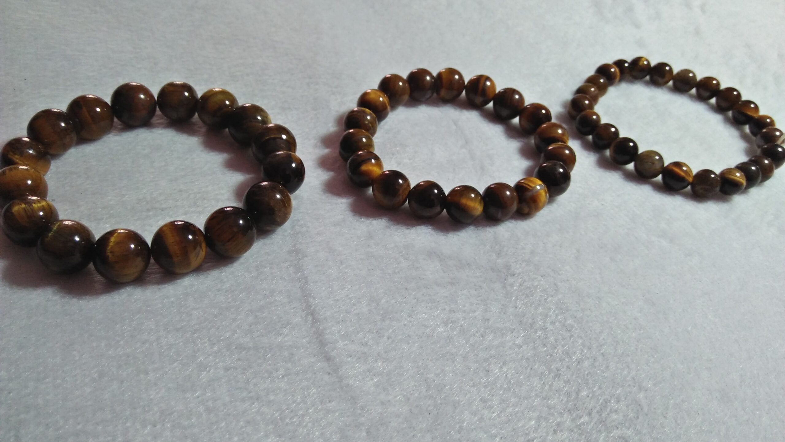 Tiger Eye Bracelet  Stone : Natural Tiger Eye Shape : Round Size : 8.8mm / 10.3mm / 12mm Treatment : Unheated / Natural Design : GenTiger Eye Bracelet  Stone : Natural Tiger Eye Shape : Round Size : 8.8mm / 10.3mm / 12mm Treatment : Unheated / Natural Design : Gent / Ladies Botht / Ladies Both