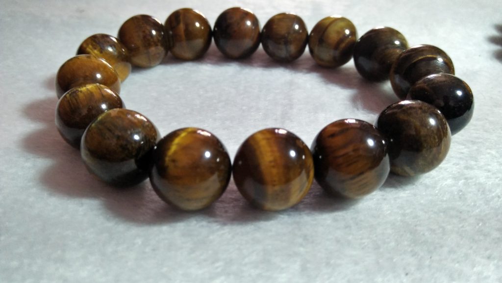 Tiger Eye Bracelet  Stone : Natural Tiger Eye Shape : Round Size : 8.8mm / 10.3mm / 12mm Treatment : Unheated / Natural Design : Gent / Ladies Both
