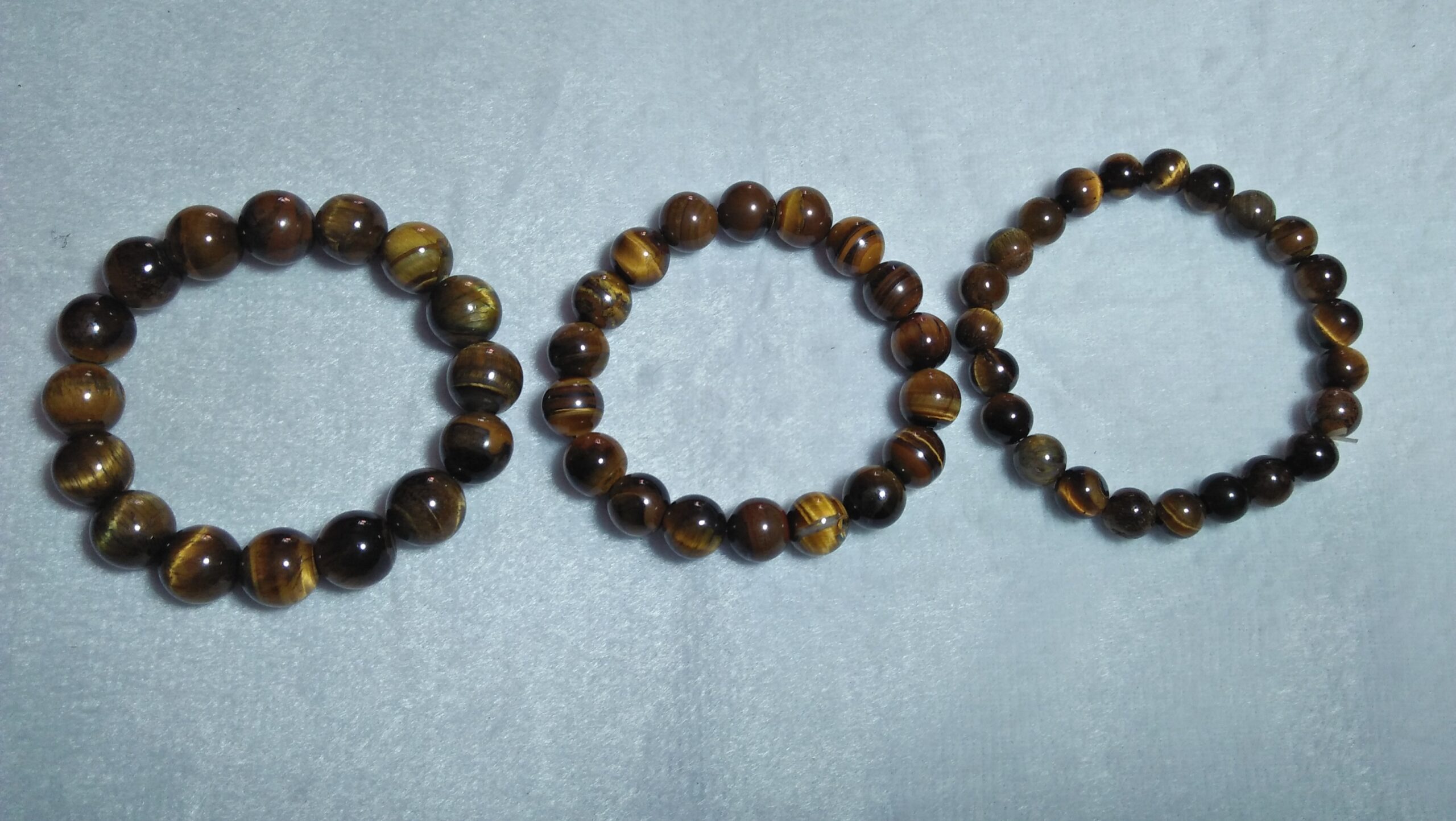 Tiger Eye Bracelet  Stone : Natural Tiger Eye Shape : Round Size : 8.8mm / 10.3mm / 12mm Treatment : Unheated / Natural Design : Gent / Ladies Both