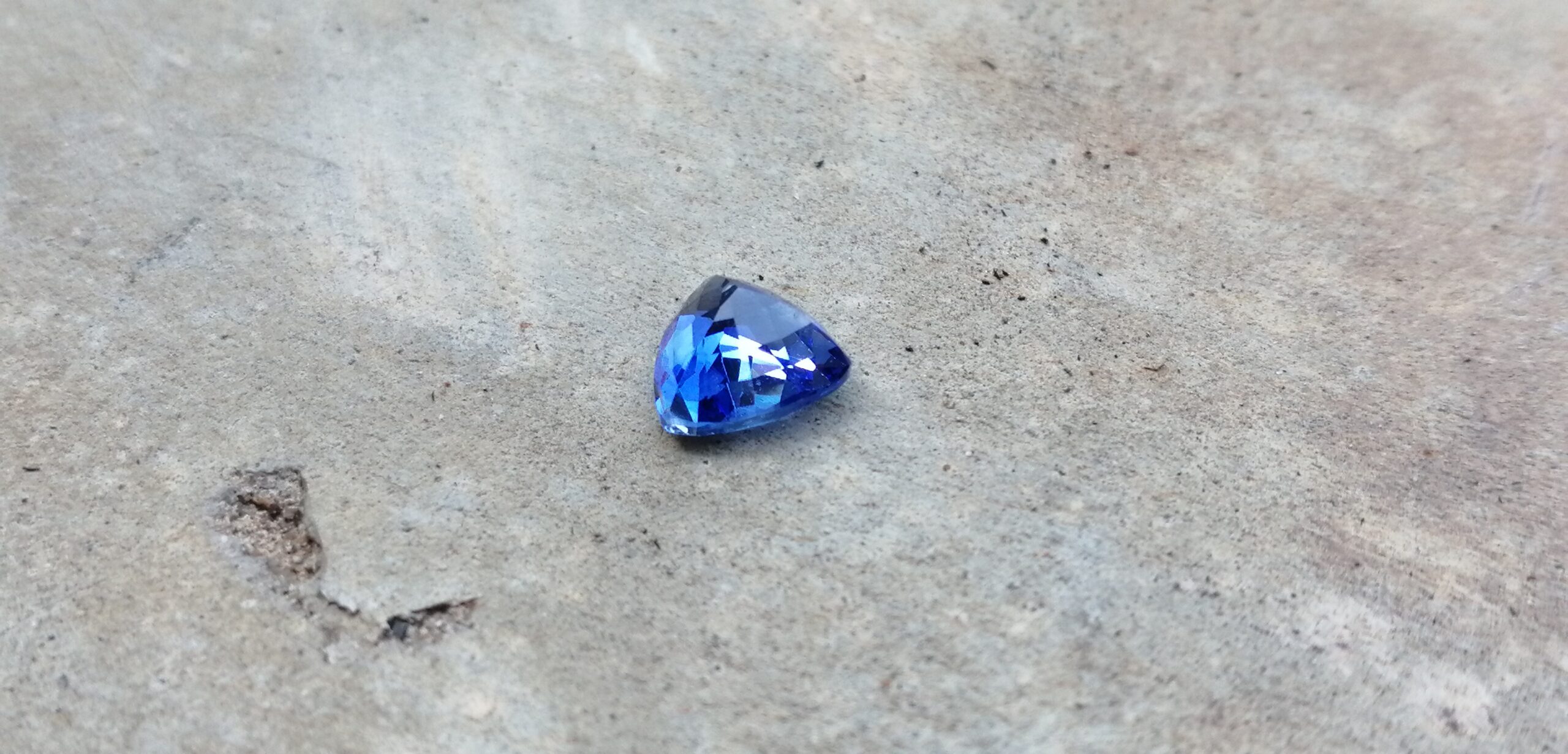NATURAL BLUE SAPPHIRE "Cornflower Blue" Colour : Blue "Cornflower Blue" Shape : Trilian Treatment : Heated Clarity : SI • CSL - Colored Stone Laboratory Certified ( GIA Alumina Association Member ) We hide certificates of sold out product Sapphire is a precious gemstone, a variety of the mineral corundum, consisting of aluminum oxide with trace amounts of elements such as iron, titanium, chromium, copper, or magnesium. Sapphire deposits are found in Eastern Australia, Thailand, Sri Lanka, China, Vietnam, Madagascar, Greenland, East Africa, and in North America in mostly in Montana. Madagascar, Sri Lanka, and Kashmir produce large quantities of fine quality Sapphires for the world market. Sapphires are mined from alluvial deposits or from primary underground workings. Blue Sapphire and Ruby are the most popular Gemstone in Corundum Family. also, Orangy Pink Sapphire is called Padparadscha. The name Drive's from the Sinhalese word "padmaraga" " පද්මරාග", meaning lotus blossom, as the stone is of a similar color to the lotus blossom. Bi-Color Sapphire from DanuGroup Collection Also, Sapphire can be found as parti-color, bi-color or fancy color. Australia is a main parti-color Sapphire producer. White Sapphire also, White sapphire is a very popular stone to wear instead of Diamond as a 3rd hardness gemstone after diamond ( moissanite hardness is 9.5). Various colors of star sapphires A star sapphire is a type of sapphire that exhibits a star-like phenomenon known as asterism. Also, A rare variety of natural sapphire, known as color-change sapphire, exhibits different colors in a different light. Sapphires can be treated by several methods to enhance and improve their clarity and color. A common method is done by heating the sapphires in furnaces to temperatures between 500 and 1,850 °C for several hours, or by heating in a nitrogen-deficient atmosphere oven for 1 week or more. Geuda is a form of the mineral corundum. Geuda is found primarily in Sri Lanka. It's a semitransparent and milky appearance due to rutile inclusions. Geuda is used to improve its color by heat treatment. Some geuda varieties turn to a blue color after heat treatments and some turn to red after oxidizing. Also, Kowangu pushparaga turns to yellow sapphire after oxidizing. Sapphire Crystal system is a Trigonal crystal system with a hexagonal scalenohedral crystal class. Sapphire hardness is 9 according to the Mohs hardness scale with 4.0~4.1 specific gravity. Refractive index ω =1.768–1.772 nε =1.760–1.763 Solubility = Insoluble Melting point = 2,030–2,050 °C Birefringence = 0.008 Pleochroism = Strong Luster = Vitreous Sapphire is the birthstone for September and the gem of the 45th anniversary. Healing Properties of Sapphire Sapphire releases mental tension, depression, unwanted thoughts, and spiritual confusion. Sapphire is known as a "stone of Wisdom". It is exceptional for calming and focusing the mind, allowing the release of mental tension and unwanted thoughts. Sapphire is also the best stone for awakening chakras. Dark Blue or Indigo Sapphire stimulates the Third Eye chakra. Blue Sapphire stimulates the Throat Chakra. Green sapphire stimulates Heart Chakra. Black Sapphire stimulates Base Chakra. White sapphire stimulates Crown Chakra. Yellow sapphire stimulates Solar Plexus Chakra. Blue Sapphire stimulates the Throat Chakra and Third eye chakra, the voice of the body. Blue crystal energy will unblock and balance the Throat Chakra. blue encourages the power of truth, while lighter shades carry the power of flexibility, relaxation, and balance. Blue Sapphire can free one of mental anxiety, helps make one detached, and protects against envy. Also, It can be worn for good luck and for protection against evil spirits. Since Saturn rules the nervous system, blue sapphires help problems of the nerves-tension and neuroses-diseases caused by an afflicted Saturn.