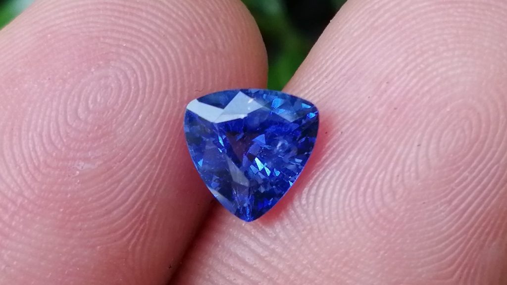 NATURAL BLUE SAPPHIRE "Cornflower Blue" Colour : Blue "Cornflower Blue" Shape : Trilian Treatment : Heated Clarity : SI • CSL - Colored Stone Laboratory Certified ( GIA Alumina Association Member ) We hide certificates of sold out product  Sapphire is a precious gemstone, a variety of the mineral corundum, consisting of aluminum oxide with trace amounts of elements such as iron, titanium, chromium, copper, or magnesium. Sapphire deposits are found in Eastern Australia, Thailand, Sri Lanka, China, Vietnam, Madagascar, Greenland, East Africa, and in North America in mostly in Montana. Madagascar, Sri Lanka, and Kashmir produce large quantities of fine quality Sapphires for the world market. Sapphires are mined from alluvial deposits or from primary underground workings. Blue Sapphire and Ruby are the most popular Gemstone in Corundum Family. also, Orangy Pink Sapphire is called Padparadscha. The name Drive's from the Sinhalese word "padmaraga" " පද්මරාග", meaning lotus blossom, as the stone is of a similar color to the lotus blossom. Bi-Color Sapphire from DanuGroup Collection Also, Sapphire can be found as parti-color, bi-color or fancy color. Australia is a main parti-color Sapphire producer. White Sapphire also, White sapphire is a very popular stone to wear instead of Diamond as a 3rd hardness gemstone after diamond ( moissanite hardness is 9.5). Various colors of star sapphires A star sapphire is a type of sapphire that exhibits a star-like phenomenon known as asterism. Also, A rare variety of natural sapphire, known as color-change sapphire, exhibits different colors in a different light. Sapphires can be treated by several methods to enhance and improve their clarity and color. A common method is done by heating the sapphires in furnaces to temperatures between 500 and 1,850 °C for several hours, or by heating in a nitrogen-deficient atmosphere oven for 1 week or more. Geuda is a form of the mineral corundum. Geuda is found primarily in Sri Lanka. It's a semitransparent and milky appearance due to rutile inclusions. Geuda is used to improve its color by heat treatment. Some geuda varieties turn to a blue color after heat treatments and some turn to red after oxidizing. Also, Kowangu pushparaga turns to yellow sapphire after oxidizing. Sapphire Crystal system is a Trigonal crystal system with a hexagonal scalenohedral crystal class. Sapphire hardness is 9 according to the Mohs hardness scale with 4.0~4.1 specific gravity. Refractive index ω          =1.768–1.772 nε =1.760–1.763 Solubility = Insoluble Melting point = 2,030–2,050 °C Birefringence  = 0.008 Pleochroism = Strong Luster = Vitreous Sapphire is the birthstone for September and the gem of the 45th anniversary. Healing Properties of Sapphire Sapphire releases mental tension, depression, unwanted thoughts, and spiritual confusion.  Sapphire is known as a "stone of Wisdom". It is exceptional for calming and focusing the mind, allowing the release of mental tension and unwanted thoughts. Sapphire is also the best stone for awakening chakras. Dark Blue or Indigo Sapphire stimulates the Third Eye chakra. Blue Sapphire stimulates the Throat Chakra. Green sapphire stimulates Heart Chakra. Black Sapphire stimulates Base Chakra. White sapphire stimulates Crown Chakra. Yellow sapphire stimulates Solar Plexus Chakra. Blue Sapphire stimulates the Throat Chakra and Third eye chakra, the voice of the body. Blue crystal energy will unblock and balance the Throat Chakra. blue encourages the power of truth, while lighter shades carry the power of flexibility, relaxation, and balance. Blue Sapphire can free one of mental anxiety, helps make one detached, and protects against envy. Also, It can be worn for good luck and for protection against evil spirits. Since Saturn rules the nervous system, blue sapphires help problems of the nerves-tension and neuroses-diseases caused by an afflicted Saturn.