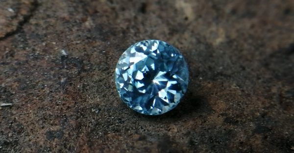 Colour: Light Green-Blue Shape: Round Weight : 2.31 Cts Dimension : 6.9 x 6.8 x 5.3 mm Locality: Cambodia Treatment: No identification of heat treatment on the Lab Report. but, Blue Zircon is Heated Clarity : VS • CSL - Colored Stone Laboratory Certified ( GIA Alumina Association Member ) • CSL Memo No: 82E5EB04FC43 Blue Zircon Stimulates Throat Chakra. It is a very popular gemstone in the new fashion world for brilliance pieces of jewelry. Zircon is a nesosilicates group mineral. Its corresponding chemical formula is ZrSiO4. The name derives from the Persian zargun, meaning "gold-hued". Zircon is a popular gemstone that has been used for nearly 2000 years. The crystal structure of zircon is a tetragonal crystal mineral with 7.5 hardness according to the Mohs Hardness scale. Zircon is also very resistant to heat and corrosion and known as Insoluble gemstone. This Uniaxial (+) mineral Specific gravity is 4.6–4.7. It's heavy more than such as Sapphire, chrysoberyl, Garnets, spinels. Gem Businessmen use these physical properties to identify zircons from other gemstones. Zircon has weak pleochroism and has colors such as Colorless, Very Strong Blue To Green-Blue, Yellow, Blue-Green, Yellowish Green, Yellow-Green, Brown, Orangy Yellow To Reddish Orange, Dark Brownish Red, Sometimes Purple, Gray To Bluish Gray, Brownish Gray. Colorless specimens that show gem quality are a popular substitute for diamond and are also known as "Matara diamond". Zircon has been classified into three types called high zircon, intermediate zircon ( medium zircon ), and low zircon. Some Quality Type brown zircons can be transformed into colorless and blue zircons by heating to 800 to 1000 °C. There are Some using names for Zircon such as Hyacinth or jacinth: yellow-red, orange, red-brown to brown, Jargoon or jargon: light yellow to colorless stones, Beccarite: green zircon, Melichrysos: straw yellow, Starlite: blue heat treated zircon, Sparklite: colorless zircon. Zircon is found in Madagascar, Sri Lanka, Tanzania, Cambodia, Australia, Burma, Afghanistan, Canada, USA, Thailand, Russia, Mozambique, Norway. Healing Properties 👇 Zircon is known as "The stone of virtue" All colors. It clears the auric negativity in the wearer and helps to communicate with the higher realm when in need. Zircon is very well known for its balancing and positive energy effects. It can attract happiness, prosperity, and abundance to the wearer. It will bring the spiritual energy down from the higher transpersonal chakras via the crown chakra, then move it to all of the lower chakras.