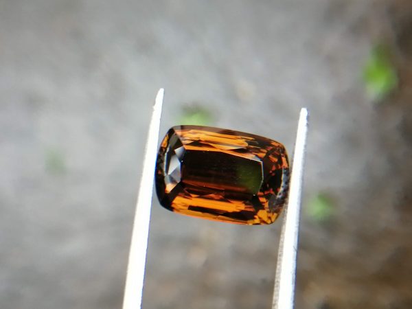 Colour : Brown Shape : Cushion Weight : 5.43 Cts Dimension : 12.4 x 8.5 x 6.3 mm Treatment : Unheated Clarity: VVS • CSL - Colored Stone Laboratory Certified ( GIA Alumina Association Member ) • CSL Memo No : 693F81AA1E41 Dravite Tourmaline Sri Lanka Dravite is the sodium magnesium rich Variety in the tourmaline family. Tourmaline is a crystalline boron silicate mineral compounded with elements such as aluminium, iron, magnesium, sodium, lithium, or potassium.                            The gemstone comes in a wide variety of colors such as black, brown, red, orange, yellow, green, blue, violet, pink, bi-colored, tri-colored and rarely can be neon green or electric blue.                               Tourmaline pleochroism is typically moderate to Strong. It is Cyclosilicate mineral with 7-7.5 hardness according to the more hardness scale and 3.06 (+.20 -.06) specific gravity. It is a Double refractive, uniaxial (-) mineral with the Trigonal crystal system. Tourmaline can be seen fluorescent inert to very weak red to violet in the long and short wave in pink Stones.                  Tourmaline can be found in India, Brazil, Tanzania, Nigeria, Kenya, Madagascar, Mozambique, Namibia, Afghanistan, Sri Lanka, USA, Ethiopia. Tourmaline Healing Properties              Tourmaline balances the right-left sides of the brain. It Helps treat paranoia, overcomes dyslexia. Also, It Improves circulation and supports the liver and kidneys.                            Tourmaline helps to eliminate toxic metals in the body and Reduces lactic acids and free fatty acids. It is a stone of purification, cleansing the emotional body of negative thoughts, anxieties, anger, and feelings of unworthiness.                         The brown tourmaline brings gentle and soothing healing of your emotional body. It is a very strong grounding stone that raises one’s stamina and protective energies. Brown tourmaline works specifically with the heart chakra to provide self-healing and rejuvenating energies.