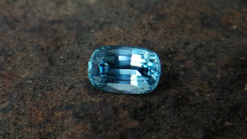 Colour: Light Green-Blue Shape: Cushion Weight : 2.27 Cts Dimension: 8.6 x 5.7 x 4.3 mm Locality: Cambodia Treatment : No identification of heat treatment on the Lab Report. but, Blue Zircon is Heated Clarity : VS • CSL - Colored Stone Laboratory Certified ( GIA Alumina Association Member ) • CSL Memo No : 20C8DF140115 Blue Zircon Stimulates Throat Chakra. It is a very popular gemstone in the new fashion world for brilliance pieces of jewelry. Zircon is a nesosilicates group mineral. Its corresponding chemical formula is ZrSiO4. The name derives from the Persian zargun, meaning "gold-hued". Zircon is a popular gemstone that has been used for nearly 2000 years. The crystal structure of zircon is a tetragonal crystal mineral with 7.5 hardness according to the Mohs Hardness scale. Zircon is also very resistant to heat and corrosion and known as Insoluble gemstone. This Uniaxial (+) mineral Specific gravity is 4.6–4.7. It's heavy more than such as Sapphire, chrysoberyl, Garnets, spinels. Gem Businessmen use these physical properties to identify zircons from other gemstones. Zircon has weak pleochroism and has colors such as Colorless, Very Strong Blue To Green-Blue, Yellow, Blue-Green, Yellowish Green, Yellow-Green, Brown, Orangy Yellow To Reddish Orange, Dark Brownish Red, Sometimes Purple, Gray To Bluish Gray, Brownish Gray. Colorless specimens that show gem quality are a popular substitute for diamond and are also known as "Matara diamond". Zircon has been classified into three types called high zircon, intermediate zircon ( medium zircon ), and low zircon. Some Quality Type brown zircons can be transformed into colorless and blue zircons by heating to 800 to 1000 °C. There are Some using names for Zircon such as Hyacinth or jacinth: yellow-red, orange, red-brown to brown, Jargoon or jargon: light yellow to colorless stones, Beccarite: green zircon, Melichrysos: straw yellow, Starlite: blue heat treated zircon, Sparklite: colorless zircon. Zircon is found in Madagascar, Sri Lanka, Tanzania, Cambodia, Australia, Burma, Afghanistan, Canada, USA, Thailand, Russia, Mozambique, Norway. Healing Properties 👇 Zircon is known as "The stone of virtue" All colors. It clears the auric negativity in the wearer and helps to communicate with the higher realm when in need. Zircon is very well known for its balancing and positive energy effects. It can attract happiness, prosperity, and abundance to the wearer. It will bring the spiritual energy down from the higher transpersonal chakras via the crown chakra, then move it to all of the lower chakras.
