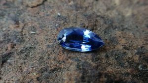 Colour: Blue Shape : Pear Weight : 1.53 cts Dimension : 9.7 x 4.9 x 3.6 mm Treatment : Unheated Clarity : SI • CSL - Colored Stone Laboratory Certified ( GIA Alumina Association Member ) • CSL Memo No : D8989ACE4A36 Sapphire is a precious gemstone, a variety of the mineral corundum, consisting of aluminium oxide with trace amounts of elements such as iron, titanium, chromium, copper, or magnesium. Sapphire is a precious gemstone, a variety of the mineral corundum, consisting of aluminum oxide with trace amounts of elements such as iron, titanium, chromium, copper, or magnesium. Sapphire deposits are found in Eastern Australia, Thailand, Sri Lanka, China, Vietnam, Madagascar, Greenland, East Africa, and in North America in mostly in Montana. Madagascar, Sri Lanka, and Kashmir produce large quantities of fine quality Sapphires for the world market. Sapphires are mined from alluvial deposits or from primary underground workings.   Blue Sapphire and Ruby are the most popular Gemstone in Corundum Family. also, Orangy Pink Sapphire is called Padparadscha. The name Drive's from the Sinhalese word "padmaraga" " පද්මරාග", meaning lotus blossom, as the stone is of a similar color to the lotus blossom. Bi-Color Sapphire from DanuGroup Collection Also, Sapphire can be found as parti-color, bi-color or fancy color. Australia is a main parti-color Sapphire producer. White Sapphire also, White sapphire is a very popular stone to wear instead of Diamond as a 3rd hardness gemstone after diamond ( moissanite hardness is 9.5). Various colors of star sapphires A star sapphire is a type of sapphire that exhibits a star-like phenomenon known as asterism. Also, A rare variety of natural sapphire, known as color-change sapphire, exhibits different colors in a different light. Sapphires can be treated by several methods to enhance and improve their clarity and color. A common method is done by heating the sapphires in furnaces to temperatures between 500 and 1,850 °C for several hours, or by heating in a nitrogen-deficient atmosphere oven for 1 week or more. Geuda is a form of the mineral corundum. Geuda is found primarily in Sri Lanka. It's a semitransparent and milky appearance due to rutile inclusions. Geuda is used to improve its color by heat treatment. Some geuda varieties turn to a blue color after heat treatments and some turn to red after oxidizing. Also, Kowangu pushparaga turns to yellow sapphire after oxidizing. Sapphire Crystal system is a Trigonal crystal system with a hexagonal scalenohedral crystal class. Sapphire hardness is 9 according to the Mohs hardness scale with 4.0~4.1 specific gravity. Refractive index ω          =1.768–1.772 nε =1.760–1.763 Solubility = Insoluble Melting point = 2,030–2,050 °C Birefringence  = 0.008 Pleochroism = Strong Luster = Vitreous Sapphire is the birthstone for September and the gem of the 45th anniversary. Healing Properties of Sapphire Sapphire releases mental tension, depression, unwanted thoughts, and spiritual confusion.  Sapphire is known as a "stone of Wisdom". It is exceptional for calming and focusing the mind, allowing the release of mental tension and unwanted thoughts. Sapphire is also the best stone for awakening chakras. Dark Blue or Indigo Sapphire stimulates the Third Eye chakra. Blue Sapphire stimulates the Throat Chakra. Green sapphire stimulates Heart Chakra. Black Sapphire stimulates Base Chakra. White sapphire stimulates Crown Chakra. Yellow sapphire stimulates Solar Plexus Chakra. Blue Sapphire stimulates the Throat Chakra, the voice of the body. Blue crystal energy will unblock and balance the Throat Chakra. blue encourages the power of truth, while lighter shades carry the power of flexibility, relaxation, and balance. Blue Sapphire can free one of mental anxiety, helps make one detached, and protects against envy. Also, It can be worn for good luck and for protection against evil spirits. Since Saturn rules the nervous system, blue sapphires help problems of the nerves-tension and neuroses-diseases caused by an afflicted Saturn.