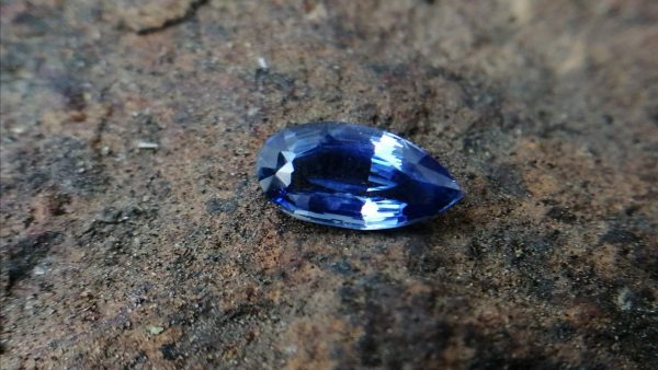 Colour: Blue Shape : Pear Weight : 1.53 cts Dimension : 9.7 x 4.9 x 3.6 mm Treatment : Unheated Clarity : SI • CSL - Colored Stone Laboratory Certified ( GIA Alumina Association Member ) • CSL Memo No : D8989ACE4A36 Sapphire is a precious gemstone, a variety of the mineral corundum, consisting of aluminium oxide with trace amounts of elements such as iron, titanium, chromium, copper, or magnesium. Sapphire is a precious gemstone, a variety of the mineral corundum, consisting of aluminum oxide with trace amounts of elements such as iron, titanium, chromium, copper, or magnesium. Sapphire deposits are found in Eastern Australia, Thailand, Sri Lanka, China, Vietnam, Madagascar, Greenland, East Africa, and in North America in mostly in Montana. Madagascar, Sri Lanka, and Kashmir produce large quantities of fine quality Sapphires for the world market. Sapphires are mined from alluvial deposits or from primary underground workings.   Blue Sapphire and Ruby are the most popular Gemstone in Corundum Family. also, Orangy Pink Sapphire is called Padparadscha. The name Drive's from the Sinhalese word "padmaraga" " පද්මරාග", meaning lotus blossom, as the stone is of a similar color to the lotus blossom. Bi-Color Sapphire from DanuGroup Collection Also, Sapphire can be found as parti-color, bi-color or fancy color. Australia is a main parti-color Sapphire producer. White Sapphire also, White sapphire is a very popular stone to wear instead of Diamond as a 3rd hardness gemstone after diamond ( moissanite hardness is 9.5). Various colors of star sapphires A star sapphire is a type of sapphire that exhibits a star-like phenomenon known as asterism. Also, A rare variety of natural sapphire, known as color-change sapphire, exhibits different colors in a different light. Sapphires can be treated by several methods to enhance and improve their clarity and color. A common method is done by heating the sapphires in furnaces to temperatures between 500 and 1,850 °C for several hours, or by heating in a nitrogen-deficient atmosphere oven for 1 week or more. Geuda is a form of the mineral corundum. Geuda is found primarily in Sri Lanka. It's a semitransparent and milky appearance due to rutile inclusions. Geuda is used to improve its color by heat treatment. Some geuda varieties turn to a blue color after heat treatments and some turn to red after oxidizing. Also, Kowangu pushparaga turns to yellow sapphire after oxidizing. Sapphire Crystal system is a Trigonal crystal system with a hexagonal scalenohedral crystal class. Sapphire hardness is 9 according to the Mohs hardness scale with 4.0~4.1 specific gravity. Refractive index ω          =1.768–1.772 nε =1.760–1.763 Solubility = Insoluble Melting point = 2,030–2,050 °C Birefringence  = 0.008 Pleochroism = Strong Luster = Vitreous Sapphire is the birthstone for September and the gem of the 45th anniversary. Healing Properties of Sapphire Sapphire releases mental tension, depression, unwanted thoughts, and spiritual confusion.  Sapphire is known as a "stone of Wisdom". It is exceptional for calming and focusing the mind, allowing the release of mental tension and unwanted thoughts. Sapphire is also the best stone for awakening chakras. Dark Blue or Indigo Sapphire stimulates the Third Eye chakra. Blue Sapphire stimulates the Throat Chakra. Green sapphire stimulates Heart Chakra. Black Sapphire stimulates Base Chakra. White sapphire stimulates Crown Chakra. Yellow sapphire stimulates Solar Plexus Chakra. Blue Sapphire stimulates the Throat Chakra, the voice of the body. Blue crystal energy will unblock and balance the Throat Chakra. blue encourages the power of truth, while lighter shades carry the power of flexibility, relaxation, and balance. Blue Sapphire can free one of mental anxiety, helps make one detached, and protects against envy. Also, It can be worn for good luck and for protection against evil spirits. Since Saturn rules the nervous system, blue sapphires help problems of the nerves-tension and neuroses-diseases caused by an afflicted Saturn.