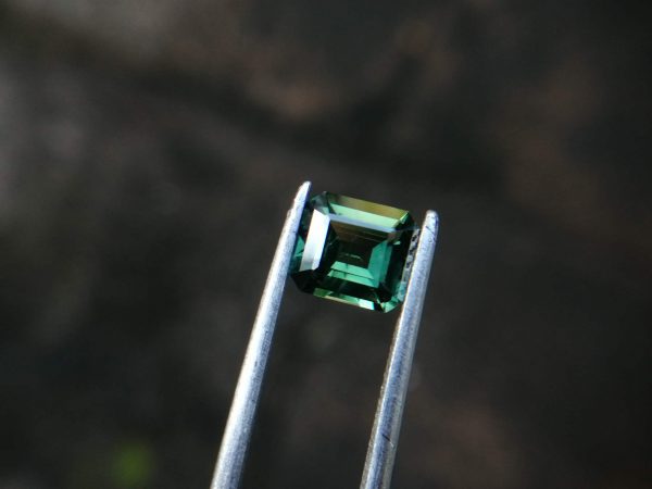 Natural Green Sapphire  Colour : Green Shape : Octagon Weight : 1.52 CTS Dimension : 6.8 x 6.0 x 3.7 mm Treatment : Unheated Clarity : VS • CSL - Colored Stone Laboratory Certified ( GIA Alumni Association Member ) • CSL Memo No : C25A834CB509 Sapphire is a precious gemstone, a variety of the mineral corundum, consisting of aluminum oxide with trace amounts of elements such as iron, titanium, chromium, copper, or magnesium. Sapphire deposits are found in Eastern Australia, Thailand, Sri Lanka, China, Vietnam, Madagascar, Greenland, East Africa, and in North America in mostly in Montana. Madagascar, Sri Lanka, and Kashmir produce large quantities of fine quality Sapphires for the world market. Sapphires are mined from alluvial deposits or from primary underground workings. Blue Sapphire and Ruby are the most popular Gemstone in Corundum Family. also, Orangy Pink Sapphire is called Padparadscha. The name Drive's from the Sinhalese word "padmaraga" " පද්මරාග", meaning lotus blossom, as the stone is of a similar color to the lotus blossom. Bi-Color Sapphire from DanuGroup Collection Also, Sapphire can be found as parti-color, bi-color or fancy color. Australia is a main parti-color Sapphire producer. White Sapphire also, White sapphire is a very popular stone to wear instead of Diamond as a 3rd hardness gemstone after diamond ( moissanite hardness is 9.5). Various colors of star sapphires A star sapphire is a type of sapphire that exhibits a star-like phenomenon known as asterism. Also, A rare variety of natural sapphire, known as color-change sapphire, exhibits different colors in a different light. Sapphires can be treated by several methods to enhance and improve their clarity and color. A common method is done by heating the sapphires in furnaces to temperatures between 500 and 1,850 °C for several hours, or by heating in a nitrogen-deficient atmosphere oven for 1 week or more. Geuda is a form of the mineral corundum. Geuda is found primarily in Sri Lanka. It's a semitransparent and milky appearance due to rutile inclusions. Geuda is used to improve its color by heat treatment. Some geuda varieties turn to a blue color after heat treatments and some turn to red after oxidizing. Also, Kowangu pushparaga turns to yellow sapphire after oxidizing. Sapphire Crystal system is a Trigonal crystal system with a hexagonal scalenohedral crystal class. Sapphire hardness is 9 according to the Mohs hardness scale with 4.0~4.1 specific gravity. Refractive index ω          =1.768–1.772 nε =1.760–1.763 Solubility = Insoluble Melting point = 2,030–2,050 °C Birefringence  = 0.008 Pleochroism = Strong Luster = Vitreous Sapphire is the birthstone for September and the gem of the 45th anniversary. Healing Properties of Sapphire Sapphire releases mental tension, depression, unwanted thoughts, and spiritual confusion.  Sapphire is known as a "stone of Wisdom". It is exceptional for calming and focusing the mind, allowing the release of mental tension and unwanted thoughts. Sapphire is also the best stone for awakening chakras. Dark Blue or Indigo Sapphire stimulates the Third Eye chakra. Blue Sapphire stimulates the Throat Chakra. Green sapphire stimulates Heart Chakra. Black Sapphire stimulates Base Chakra. White sapphire stimulates Crown Chakra. Yellow sapphire stimulates Solar Plexus Chakra. In Vedic astrology, Green Sapphire represents planet Mercury and is worn to bring calmness and positivity, improve concentration, self-confidence, and overall mental health. It is also recommended as an effective healing stone for varied healing therapies. Green Sapphire opens the heart to compassion. It helps in understanding others’ needs and encourages respect for differences. It stimulates the Heart Chakra located near the center of the breastbone.
