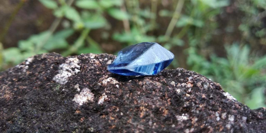 Blue Sapphire is a color variety of mineral corundum. The intense blue of the sapphire is caused by the addition of titanium and iron to the mineral corundum. Blue Sapphire color can be described in terms of hue, saturation, and tone. It is evaluated based upon the purity of their blue hue. 