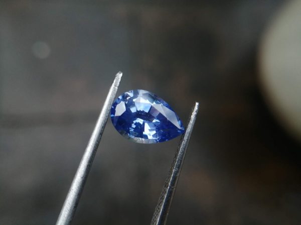 NATURAL BLUE SAPPHIRE "Cornflower Blue" Colour : Blue "Cornflower Blue" Shape : Pear Weight : 2.58 ct Dimension : 10.2 x 7.1 x 4.6 mm Treatment : Heated Clarity : SI • CSL - Colored Stone Laboratory Certified ( GIA Alumina Association Member ) • CSL Memo No : A51F60F79898 Sapphire is a precious gemstone, a variety of the mineral corundum, consisting of aluminum oxide with trace amounts of elements such as iron, titanium, chromium, copper, or magnesium. Sapphire deposits are found in Eastern Australia, Thailand, Sri Lanka, China, Vietnam, Madagascar, Greenland, East Africa, and in North America in mostly in Montana. Madagascar, Sri Lanka, and Kashmir produce large quantities of fine quality Sapphires for the world market. Sapphires are mined from alluvial deposits or from primary underground workings. Blue Sapphire and Ruby are the most popular Gemstone in Corundum Family. also, Orangy Pink Sapphire is called Padparadscha. The name Drive's from the Sinhalese word "padmaraga" " පද්මරාග", meaning lotus blossom, as the stone is of a similar color to the lotus blossom. Bi-Color Sapphire from DanuGroup Collection Also, Sapphire can be found as parti-color, bi-color or fancy color. Australia is a main parti-color Sapphire producer. White Sapphire also, White sapphire is a very popular stone to wear instead of Diamond as a 3rd hardness gemstone after diamond ( moissanite hardness is 9.5). Various colors of star sapphires A star sapphire is a type of sapphire that exhibits a star-like phenomenon known as asterism. Also, A rare variety of natural sapphire, known as color-change sapphire, exhibits different colors in a different light. Sapphires can be treated by several methods to enhance and improve their clarity and color. A common method is done by heating the sapphires in furnaces to temperatures between 500 and 1,850 °C for several hours, or by heating in a nitrogen-deficient atmosphere oven for 1 week or more. Geuda is a form of the mineral corundum. Geuda is found primarily in Sri Lanka. It's a semitransparent and milky appearance due to rutile inclusions. Geuda is used to improve its color by heat treatment. Some geuda varieties turn to a blue color after heat treatments and some turn to red after oxidizing. Also, Kowangu pushparaga turns to yellow sapphire after oxidizing. Sapphire Crystal system is a Trigonal crystal system with a hexagonal scalenohedral crystal class. Sapphire hardness is 9 according to the Mohs hardness scale with 4.0~4.1 specific gravity. Refractive index ω          =1.768–1.772 nε =1.760–1.763 Solubility = Insoluble Melting point = 2,030–2,050 °C Birefringence  = 0.008 Pleochroism = Strong Luster = Vitreous Sapphire is the birthstone for September and the gem of the 45th anniversary. Healing Properties of Sapphire Sapphire releases mental tension, depression, unwanted thoughts, and spiritual confusion.  Sapphire is known as a "stone of Wisdom". It is exceptional for calming and focusing the mind, allowing the release of mental tension and unwanted thoughts. Sapphire is also the best stone for awakening chakras. Dark Blue or Indigo Sapphire stimulates the Third Eye chakra. Blue Sapphire stimulates the Throat Chakra. Green sapphire stimulates Heart Chakra. Black Sapphire stimulates Base Chakra. White sapphire stimulates Crown Chakra. Yellow sapphire stimulates Solar Plexus Chakra. Blue Sapphire stimulates the Throat Chakra and Third eye chakra, the voice of the body. Blue crystal energy will unblock and balance the Throat Chakra. blue encourages the power of truth, while lighter shades carry the power of flexibility, relaxation, and balance. Blue Sapphire can free one of mental anxiety, helps make one detached, and protects against envy. Also, It can be worn for good luck and for protection against evil spirits. Since Saturn rules the nervous system, blue sapphires help problems of the nerves-tension and neuroses-diseases caused by an afflicted Saturn.