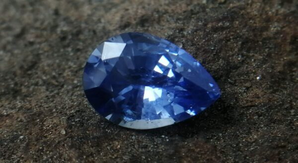 NATURAL BLUE SAPPHIRE "Cornflower Blue" Colour : Blue "Cornflower Blue" Shape : Pear Weight : 2.58 ct Dimension : 10.2 x 7.1 x 4.6 mm Treatment : Heated Clarity : SI • CSL - Colored Stone Laboratory Certified ( GIA Alumina Association Member ) • CSL Memo No : A51F60F79898 Sapphire is a precious gemstone, a variety of the mineral corundum, consisting of aluminum oxide with trace amounts of elements such as iron, titanium, chromium, copper, or magnesium. Sapphire deposits are found in Eastern Australia, Thailand, Sri Lanka, China, Vietnam, Madagascar, Greenland, East Africa, and in North America in mostly in Montana. Madagascar, Sri Lanka, and Kashmir produce large quantities of fine quality Sapphires for the world market. Sapphires are mined from alluvial deposits or from primary underground workings. Blue Sapphire and Ruby are the most popular Gemstone in Corundum Family. also, Orangy Pink Sapphire is called Padparadscha. The name Drive's from the Sinhalese word "padmaraga" " පද්මරාග", meaning lotus blossom, as the stone is of a similar color to the lotus blossom. Bi-Color Sapphire from DanuGroup Collection Also, Sapphire can be found as parti-color, bi-color or fancy color. Australia is a main parti-color Sapphire producer. White Sapphire also, White sapphire is a very popular stone to wear instead of Diamond as a 3rd hardness gemstone after diamond ( moissanite hardness is 9.5). Various colors of star sapphires A star sapphire is a type of sapphire that exhibits a star-like phenomenon known as asterism. Also, A rare variety of natural sapphire, known as color-change sapphire, exhibits different colors in a different light. Sapphires can be treated by several methods to enhance and improve their clarity and color. A common method is done by heating the sapphires in furnaces to temperatures between 500 and 1,850 °C for several hours, or by heating in a nitrogen-deficient atmosphere oven for 1 week or more. Geuda is a form of the mineral corundum. Geuda is found primarily in Sri Lanka. It's a semitransparent and milky appearance due to rutile inclusions. Geuda is used to improve its color by heat treatment. Some geuda varieties turn to a blue color after heat treatments and some turn to red after oxidizing. Also, Kowangu pushparaga turns to yellow sapphire after oxidizing. Sapphire Crystal system is a Trigonal crystal system with a hexagonal scalenohedral crystal class. Sapphire hardness is 9 according to the Mohs hardness scale with 4.0~4.1 specific gravity. Refractive index ω          =1.768–1.772 nε =1.760–1.763 Solubility = Insoluble Melting point = 2,030–2,050 °C Birefringence  = 0.008 Pleochroism = Strong Luster = Vitreous Sapphire is the birthstone for September and the gem of the 45th anniversary. Healing Properties of Sapphire Sapphire releases mental tension, depression, unwanted thoughts, and spiritual confusion.  Sapphire is known as a "stone of Wisdom". It is exceptional for calming and focusing the mind, allowing the release of mental tension and unwanted thoughts. Sapphire is also the best stone for awakening chakras. Dark Blue or Indigo Sapphire stimulates the Third Eye chakra. Blue Sapphire stimulates the Throat Chakra. Green sapphire stimulates Heart Chakra. Black Sapphire stimulates Base Chakra. White sapphire stimulates Crown Chakra. Yellow sapphire stimulates Solar Plexus Chakra. Blue Sapphire stimulates the Throat Chakra and Third eye chakra, the voice of the body. Blue crystal energy will unblock and balance the Throat Chakra. blue encourages the power of truth, while lighter shades carry the power of flexibility, relaxation, and balance. Blue Sapphire can free one of mental anxiety, helps make one detached, and protects against envy. Also, It can be worn for good luck and for protection against evil spirits. Since Saturn rules the nervous system, blue sapphires help problems of the nerves-tension and neuroses-diseases caused by an afflicted Saturn.