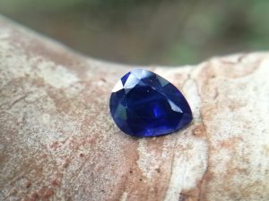 Colour : Vivid Blue "Royal Blue"  Shape : Pear  Weight : 1.00 ct  Dimension : 6.1 x 5.1 x 3.9 mm  Treatment : Heated  Clarity : I     Sapphire is a precious gemstone, a variety of the mineral corundum, consisting of aluminum oxide with trace amounts of elements such as iron, titanium, chromium, copper, or magnesium.  Sapphire deposits are found in Eastern Australia, Thailand, Sri Lanka, China, Vietnam, Madagascar, Greenland, East Africa, and in North America in mostly in Montana. Madagascar, Sri Lanka, and Kashmir produce large quantities of fine quality Sapphires for the world market. Sapphires are mined from alluvial deposits or from primary underground workings.          Blue Sapphire and Ruby are the most popular Gemstone in Corundum Family.  also, Orangy Pink Sapphire is called Padparadscha. The name Drive's from the Sinhalese word "padmaraga" " පද්මරාග", meaning lotus blossom, as the stone is of a similar color to the lotus blossom.  Bi-Color Sapphire from DanuGroup Collection  Also, Sapphire can be found as parti-color, bi-color or fancy color. Australia is a main parti-color Sapphire producer.  White Sapphire  also, White sapphire is a very popular stone to wear instead of Diamond as a 3rd hardness gemstone after diamond ( moissanite hardness is 9.5).  Various colors of star sapphires  A star sapphire is a type of sapphire that exhibits a star-like phenomenon known as asterism.  Also, A rare variety of natural sapphire, known as color-change sapphire, exhibits different colors in a different light.  Sapphires can be treated by several methods to enhance and improve their clarity and color. A common method is done by heating the sapphires in furnaces to temperatures between 500 and 1,850 °C for several hours, or by heating in a nitrogen-deficient atmosphere oven for 1 week or more. Geuda is a form of the mineral corundum. Geuda is found primarily in Sri Lanka. It's a semitransparent and milky appearance due to rutile inclusions. Geuda is used to improve its color by heat treatment. Some geuda varieties turn to a blue color after heat treatments and some turn to red after oxidizing. Also, Kowangu pushparaga turns to yellow sapphire after oxidizing.  Sapphire Crystal system is a Trigonal crystal system with a hexagonal scalenohedral crystal class. Sapphire hardness is 9 according to the Mohs hardness scale with 4.0~4.1 specific gravity.     Refractive index ω          =1.768–1.772 nε =1.760–1.763 Solubility = Insoluble  Melting point = 2,030–2,050 °C  Birefringence  = 0.008  Pleochroism = Strong  Luster = Vitreous  Sapphire is the birthstone for September and the gem of the 45th anniversary.  Healing Properties of Sapphire  Sapphire releases mental tension, depression, unwanted thoughts, and spiritual confusion.  Sapphire is known as a "stone of Wisdom". It is exceptional for calming and focusing the mind, allowing the release of mental tension and unwanted thoughts. Sapphire is also the best stone for awakening chakras. Dark Blue or Indigo Sapphire stimulates the Third Eye chakra. Blue Sapphire stimulates the Throat Chakra. Green sapphire stimulates Heart Chakra. Black Sapphire stimulates Base Chakra. White sapphire stimulates Crown Chakra. Yellow sapphire stimulates Solar Plexus Chakra.     Blue Sapphire stimulates the Throat Chakra, the voice of the body. Blue crystal energy will unblock and balance the Throat Chakra. blue encourages the power of truth, while lighter shades carry the power of flexibility, relaxation, and balance. Blue Sapphire can free one of mental anxiety, helps make one detached, and protects against envy. Also, It can be worn for good luck and for protection against evil spirits. Since Saturn rules the nervous system, blue sapphires help problems of the nerves-tension and neuroses-diseases caused by an afflicted Saturn.