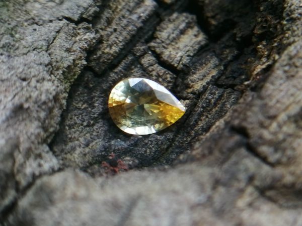 Colour : Yellow Shape : Pear Weight : 0.55 Cts Dimension : 5.9 x 3.9 x 2.9 mm Treatment : Heated Clarity : SI Sapphire is a precious gemstone, a variety of the mineral corundum, consisting of aluminum oxide with trace amounts of elements such as iron, titanium, chromium, copper, or magnesium. Sapphire deposits are found in Eastern Australia, Thailand, Sri Lanka, China, Vietnam, Madagascar, Greenland, East Africa, and in North America in mostly in Montana. Madagascar, Sri Lanka, and Kashmir produce large quantities of fine quality Sapphires for the world market. Sapphires are mined from alluvial deposits or from primary underground workings.   Blue Sapphire and Ruby are the most popular Gemstone in Corundum Family. also, Orangy Pink Sapphire is called Padparadscha. The name Drive's from the Sinhalese word "padmaraga" " පද්මරාග", meaning lotus blossom, as the stone is of a similar color to the lotus blossom. Bi-Color Sapphire from DanuGroup Collection Also, Sapphire can be found as parti-color, bi-color or fancy color. Australia is a main parti-color Sapphire producer. White Sapphire also, White sapphire is a very popular stone to wear instead of Diamond as a 3rd hardness gemstone after diamond ( moissanite hardness is 9.5). Various colors of star sapphires A star sapphire is a type of sapphire that exhibits a star-like phenomenon known as asterism. Also, A rare variety of natural sapphire, known as color-change sapphire, exhibits different colors in a different light. Sapphires can be treated by several methods to enhance and improve their clarity and color. A common method is done by heating the sapphires in furnaces to temperatures between 500 and 1,850 °C for several hours, or by heating in a nitrogen-deficient atmosphere oven for 1 week or more. Geuda is a form of the mineral corundum. Geuda is found primarily in Sri Lanka. It's a semitransparent and milky appearance due to rutile inclusions. Geuda is used to improve its color by heat treatment. Some geuda varieties turn to a blue color after heat treatments and some turn to red after oxidizing. Also, Kowangu pushparaga turns to yellow sapphire after oxidizing. Sapphire Crystal system is a Trigonal crystal system with a hexagonal scalenohedral crystal class. Sapphire hardness is 9 according to the Mohs hardness scale with 4.0~4.1 specific gravity. Refractive index ω          =1.768–1.772 nε =1.760–1.763 Solubility = Insoluble Melting point = 2,030–2,050 °C Birefringence  = 0.008 Pleochroism = Strong Luster = Vitreous Sapphire is the birthstone for September and the gem of the 45th anniversary. Healing Properties of Sapphire Sapphire releases mental tension, depression, unwanted thoughts, and spiritual confusion.  Sapphire is known as a "stone of Wisdom". It is exceptional for calming and focusing the mind, allowing the release of mental tension and unwanted thoughts. Sapphire is also the best stone for awakening chakras. Dark Blue or Indigo Sapphire stimulates the Third Eye chakra. Blue Sapphire stimulates the Throat Chakra. Green sapphire stimulates Heart Chakra. Black Sapphire stimulates Base Chakra. White sapphire stimulates Crown Chakra. Yellow sapphire stimulates Solar Plexus Chakra. Blue Sapphire stimulates the Throat Chakra, the voice of the body. Blue crystal energy will unblock and balance the Throat Chakra. blue encourages the power of truth, while lighter shades carry the power of flexibility, relaxation, and balance. Blue Sapphire can free one of mental anxiety, helps make one detached, and protects against envy. Also, It can be worn for good luck and for protection against evil spirits. Since Saturn rules the nervous system, blue sapphires help problems of the nerves-tension and neuroses-diseases caused by an afflicted Saturn.