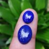 Weight : 4.55 Cts / 2.40 Cts Dimension : 14.0 x 10.0 x 4.0 mm 10.0 x 8.0 x 4.0 mm Colour : Blue Shape : Oval Treatment : Unheated Clarity : Opaque Lapis lazuli is a deep blue metamorphic ( arise from the transformation of existing rock types) rock used as a semi-precious stone, a mixture of minerals with lazurite as the main constituent. Lazurite is a tectosilicate mineral with sulfate, sulfur, and chloride. https://youtu.be/sczya3Xhk9o Lapis lazuli can be found colors such as Blue, or purple, mottled with white calcite and brassy pyrite. As Physical Properties, It has Uneven and Conchoidal fractures and a dull luster. Lapis Lazuli specific gravity is 2.7–2.9 with 5–5.5 hardness according to the Mohs hardness scale. The refractive index is Refractive Index1.500 to 1.670 as optical properties. The variations in composition cause a wide variation in the specific gravity, Refractive index and hardness values. At the end of the Middle Ages, lapis lazuli began to be exported to Europe, where it was ground into a powder and made into ultramarine, the finest and most expensive of all blue pigments. In ancient Egypt, lapis lazuli was a favorite stone for amulets and ornaments such as scarabs. Lapis lazuli is found in Afghanistan, Russia, Chile, Italy, Mongolia, Pakistan, the United States, and Canada. Afghanistan is the major source of lapis lazuli. Healing properties of Lapis lazuli 💎 Lapis lazuli associates with Throat Chakra and Third Eye Chakra. Lapis Lazuli activates the psychic centers at the Third Eye and balances the energies of the Throat Chakra. Also, Lapis lazuli is the September birthstone. Lapis Lazuli releases stress, bringing peace, harmony, and inner self-knowledge.  Lapis Lazuli boosts the immune system, purifies the blood and lowers blood pressure. Lapis is one of the oldest spiritual stones known to man, used by healers, priests and royalty, for power, wisdom and to stimulate psychic abilities and inner vision.