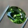 Natural Green Zircon Sri Lanka - Beccarite Zircon Colour: Green Shape: Oval Weight : 1.85 Cts Dimension : 8.1 x 6.1 x 4.5 mm Treatment: Unheated Clarity : SI Origin : Sri Lanka Zircon is a nesosilicates group mineral. Its corresponding chemical formula is ZrSiO4. The name derives from the Persian zargun, meaning "gold-hued". Zircon is a popular gemstone that has been used for nearly 2000 years. The crystal structure of zircon is a tetragonal crystal mineral with 7.5 hardness according to the Mohs Hardness scale. Zircon is also very resistant to heat and corrosion and known as Insoluble gemstone. This Uniaxial (+) mineral Specific gravity is 4.6–4.7. It's heavy more than such as Sapphire, chrysoberyl, Garnets, spinels. Gem Businessmen use these physical properties to identify zircons from other gemstones. Zircon has weak pleochroism and has colors such as Colorless, Very Strong Blue To Green-Blue, Yellow, Blue-Green, Yellowish Green, Yellow-Green, Brown, Orangy Yellow To Reddish Orange, Dark Brownish Red, Sometimes Purple, Gray To Bluish Gray, Brownish Gray. Colorless specimens that show gem quality are a popular substitute for diamond and are also known as "Matara diamond". Zircon has been classified into three types called high zircon, intermediate zircon ( medium zircon ), and low zircon. Some Quality Type brown zircons can be transformed into colorless and blue zircons by heating to 800 to 1000 °C. There are Some using names for Zircon such as Hyacinth or jacinth: yellow-red, orange, red-brown to brown, Jargoon or jargon: light yellow to colorless stones, Beccarite: green zircon, Melichrysos: straw yellow, Starlite: blue heat treated zircon, Sparklite: colorless zircon. Zircon is found in Madagascar, Sri Lanka, Tanzania, Cambodia, Australia, Burma, Afghanistan, Canada, USA, Thailand, Russia, Mozambique, Norway. Healing Properties 👇 Zircon is known as "The stone of virtue" All colors. It clears the auric negativity in the wearer and helps to communicate with the higher realm when in need. Zircon is very well known for its balancing and positive energy effects. It can attract happiness, prosperity, and abundance to the wearer. It will bring the spiritual energy down from the higher transpersonal chakras via the crown chakra, then move it to all of the lower chakras. Green zircon stimulates the Heart chakra. Also. It is a good crystal for meditation to open heart chakra energies. Its vibrational energies help to user stay on the spiritual path.