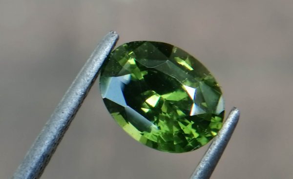 Natural Green Zircon Sri Lanka - Beccarite Zircon Colour: Green Shape: Oval Weight : 1.85 Cts Dimension : 8.1 x 6.1 x 4.5 mm Treatment: Unheated Clarity : SI Origin : Sri Lanka Zircon is a nesosilicates group mineral. Its corresponding chemical formula is ZrSiO4. The name derives from the Persian zargun, meaning "gold-hued". Zircon is a popular gemstone that has been used for nearly 2000 years. The crystal structure of zircon is a tetragonal crystal mineral with 7.5 hardness according to the Mohs Hardness scale. Zircon is also very resistant to heat and corrosion and known as Insoluble gemstone. This Uniaxial (+) mineral Specific gravity is 4.6–4.7. It's heavy more than such as Sapphire, chrysoberyl, Garnets, spinels. Gem Businessmen use these physical properties to identify zircons from other gemstones. Zircon has weak pleochroism and has colors such as Colorless, Very Strong Blue To Green-Blue, Yellow, Blue-Green, Yellowish Green, Yellow-Green, Brown, Orangy Yellow To Reddish Orange, Dark Brownish Red, Sometimes Purple, Gray To Bluish Gray, Brownish Gray. Colorless specimens that show gem quality are a popular substitute for diamond and are also known as "Matara diamond". Zircon has been classified into three types called high zircon, intermediate zircon ( medium zircon ), and low zircon. Some Quality Type brown zircons can be transformed into colorless and blue zircons by heating to 800 to 1000 °C. There are Some using names for Zircon such as Hyacinth or jacinth: yellow-red, orange, red-brown to brown, Jargoon or jargon: light yellow to colorless stones, Beccarite: green zircon, Melichrysos: straw yellow, Starlite: blue heat treated zircon, Sparklite: colorless zircon. Zircon is found in Madagascar, Sri Lanka, Tanzania, Cambodia, Australia, Burma, Afghanistan, Canada, USA, Thailand, Russia, Mozambique, Norway. Healing Properties 👇 Zircon is known as "The stone of virtue" All colors. It clears the auric negativity in the wearer and helps to communicate with the higher realm when in need. Zircon is very well known for its balancing and positive energy effects. It can attract happiness, prosperity, and abundance to the wearer. It will bring the spiritual energy down from the higher transpersonal chakras via the crown chakra, then move it to all of the lower chakras. Green zircon stimulates the Heart chakra. Also. It is a good crystal for meditation to open heart chakra energies. Its vibrational energies help to user stay on the spiritual path.