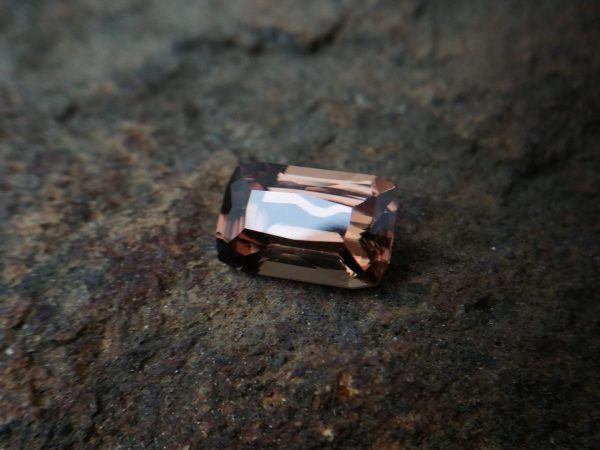 Ceylon Natural " chocolate 🍫" Zircon called "jargoon" Dimension : 11mm x 7mm x 5.3mm Weight :  4.70Cts Colour : Chocolate brown Minearal : Ratnapura Sri Lanka Treatment : Unheated Zircon is a nesosilicates group mineral. Its corresponding chemical formula is ZrSiO4. The name derives from the Persian zargun, meaning "gold-hued". Zircon is a popular gemstone that has been used for nearly 2000 years. The crystal structure of zircon is a tetragonal crystal mineral with 7.5 hardness according to the Mohs Hardness scale. Zircon is also very resistant to heat and corrosion and known as Insoluble gemstone. This Uniaxial (+) mineral Specific gravity is 4.6–4.7. It's heavy more than such as Sapphire, chrysoberyl, Garnets, spinels. Gem Businessmen use these physical properties to identify zircons from other gemstones. Zircon has weak pleochroism and has colors such as Colorless, Very Strong Blue To Green-Blue, Yellow, Blue-Green, Yellowish Green, Yellow-Green, Brown, Orangy Yellow To Reddish Orange, Dark Brownish Red, Sometimes Purple, Gray To Bluish Gray, Brownish Gray. Colorless specimens that show gem quality are a popular substitute for diamond and are also known as "Matara diamond". Zircon has been classified into three types called high zircon, intermediate zircon ( medium zircon ), and low zircon. Some Quality Type brown zircons can be transformed into colorless and blue zircons by heating to 800 to 1000 °C. There are Some using names for Zircon such as Hyacinth or jacinth: yellow-red, orange, red-brown to brown, Jargoon or jargon: light yellow to colorless stones, Beccarite: green zircon, Melichrysos: straw yellow, Starlite: blue heat treated zircon, Sparklite: colorless zircon. Zircon is found in Madagascar, Sri Lanka, Tanzania, Cambodia, Australia, Burma, Afghanistan, Canada, USA, Thailand, Russia, Mozambique, Norway. Healing Properties 👇 Zircon is known as "The stone of virtue" All colors. It clears the auric negativity in the wearer and helps to communicate with the higher realm when in need. Zircon is very well known for its balancing and positive energy effects. It can attract happiness, prosperity, and abundance to the wearer. It will bring the spiritual energy down from the higher transpersonal chakras via the crown chakra, then move it to all of the lower chakras. Green zircon stimulates the Heart chakra. Also. It is a good crystal for meditation to open heart chakra energies. Its vibrational energies help to user stay on the spiritual path. Brown is known as the color of Earth. Brown Zircon is an excellent stone for meditations and connecting with cosmic energy. Its vibrational energies help to keep calm your mind and reduce stress.