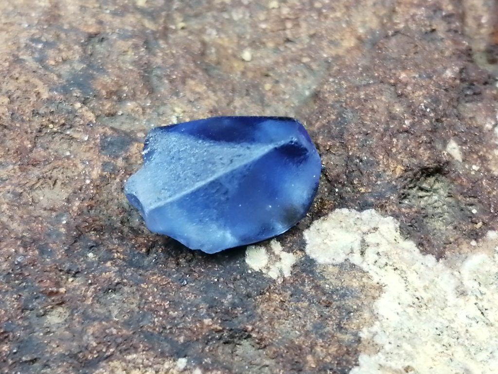 Blue Sapphire is a color variety of mineral corundum. The intense blue of the sapphire is caused by the addition of titanium and iron to the mineral corundum. Blue Sapphire color can be described in terms of hue, saturation, and tone. It is evaluated based upon the purity of their blue hue.