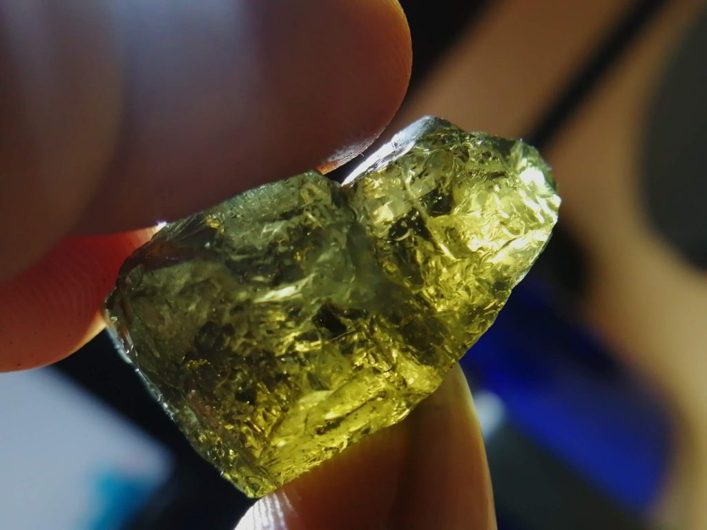 Natural Kornerupine facet grade huge gem piece found from Sri Lankan Rare Gemstone mining area. It can be seen yellowish chrom green and greenish yellow Pleochroism as a directional properties. Kornerupine is a rare boro-silicate mineral with the formula (Mg, Fe²⁺)₄(Al, Fe³⁺)₆(SiO₄, BO₄)₅(O, OH)₂. It has a specific gravity of 3.3 to 3.34 and Colours such as Colorless, white, grey, greenish, bluish, brown, black. Some Stones show strong Pleochroism such as colorless to green, colorless, pale brownish yellow, pale yellowish green, pale brownish green and green. The stone was named for the outstanding Danish mineralogist Andreas Kornerup. It crystallizes in the orthorhombic crystal structure with 6 – 7 hardness according to Mohs hardness scale. Also, This Biaxial (-) gemstone is found as Transparent to translucent and opaque. Deposits are found in Burma (Myanmar), Canada (Quebec), Kenya, Madagascar, Sri Lanka, Tanzania, and South Africa. Kornerupine also has cats eye effect and Star Effect. but, Star Effect kornarupines are very rare. Star kornerupine also has been found Myanmar. In Sri lanka is mostly found yellowish brown/brown/greenish Colours of kornerupine. Healing Properties of kornerupine 👇 This Borosilicate mineral also will useful to keep your mind peacefull. Used to stabilize and calm the emotions. It calms your inner self and imparts you mental relaxation and releases all your worries. also, Enhances teaching ability, eloquence, communication and clarity.