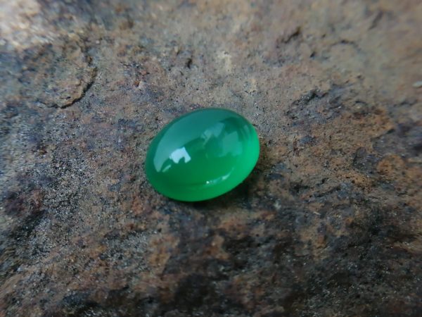 Natural Green Onyx Colour: Green Shape: Oval Cut: Cabochon Weight : 7.00 Cts Dimension : 13.9 x 11.1 x 6.5 mm Treatment: Unheated Clarity: Translucent Green Onyx is a member of the Quartz Family that has different colors and various properties and characteristics. It's A variety of Agate. Agate and onyx are both varieties of layered chalcedony that differ only in the form of the bands: agate has curved bands and onyx has parallel bands. Green Onyx can be found in Afghanistan, Australia, China, Canada, France, Germany, UK, India, Madagascar, USA. • Crystal system: Trigonal • Chemical formula: SiO₂ • Hardness (Mohs hardness scale): 6.5 - 7 • Mineral class: Chalcedony • Transparency: Translucent, Opaque • Specific gravity: 2.6–2.65 • Optical properties: Uniaxial/+ • Refractive index: 1.530 to 1.543 Main Healing Properties This Silicate mineral vibrational energy help to reduce tension, stress, and fears. also, It's green color energy increases attraction and stimulates heart chakra energies. also, Green Onyx balances blood circulations all of the body as well as Carnelian increases blood circulation. Healing Properties Green Onyx is associated with Heart Chakra and the planet Mercury. It helps to develop your public speaking ability, creativeness and also encourage you to express your feelings and thoughts. This stone creates a bridge between the upper three chakras and the lower three chakras. This green soothing stone has the power to reduce you all worries, tension, stress, and fears