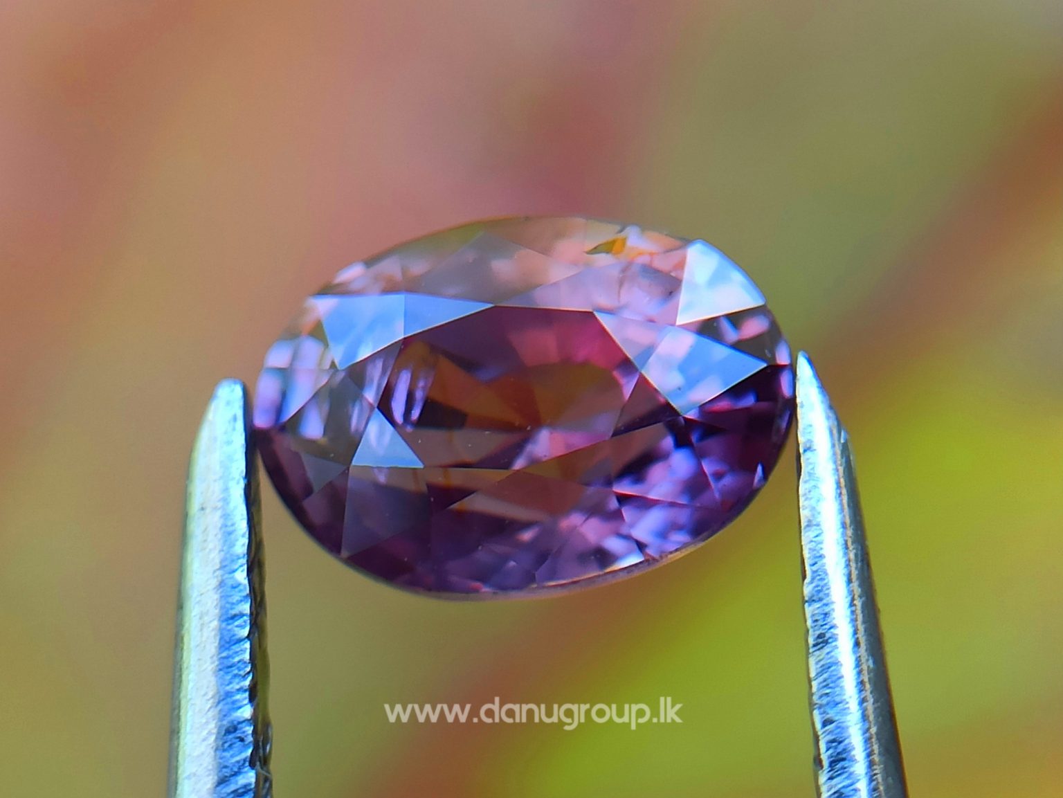 Natural Brownish Purple Sapphire Oval shape gem from Danu Group - danugroup.lk