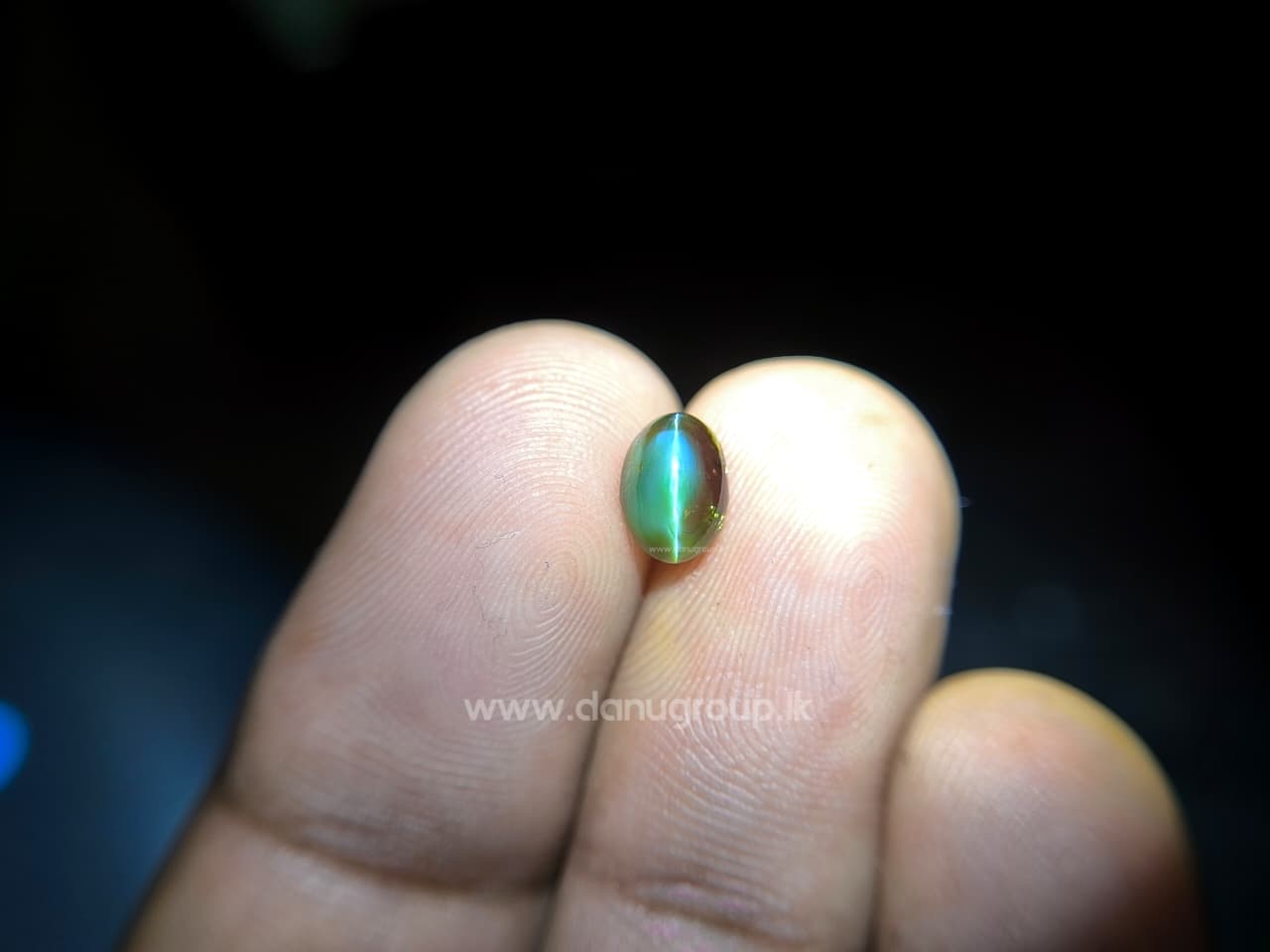 Comparison image of Alexandrite Cat’s Eye showing green and red color-change effect side by side.