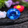 Natural 1.19 ct blue sapphire photographed on a natural background